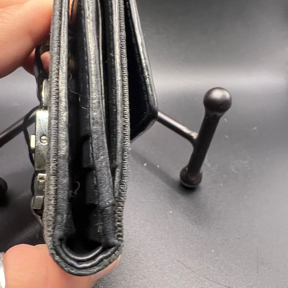 Gucci Black GG Canvas
Piston Lock Compact Wallet. - Picture 3 of 8